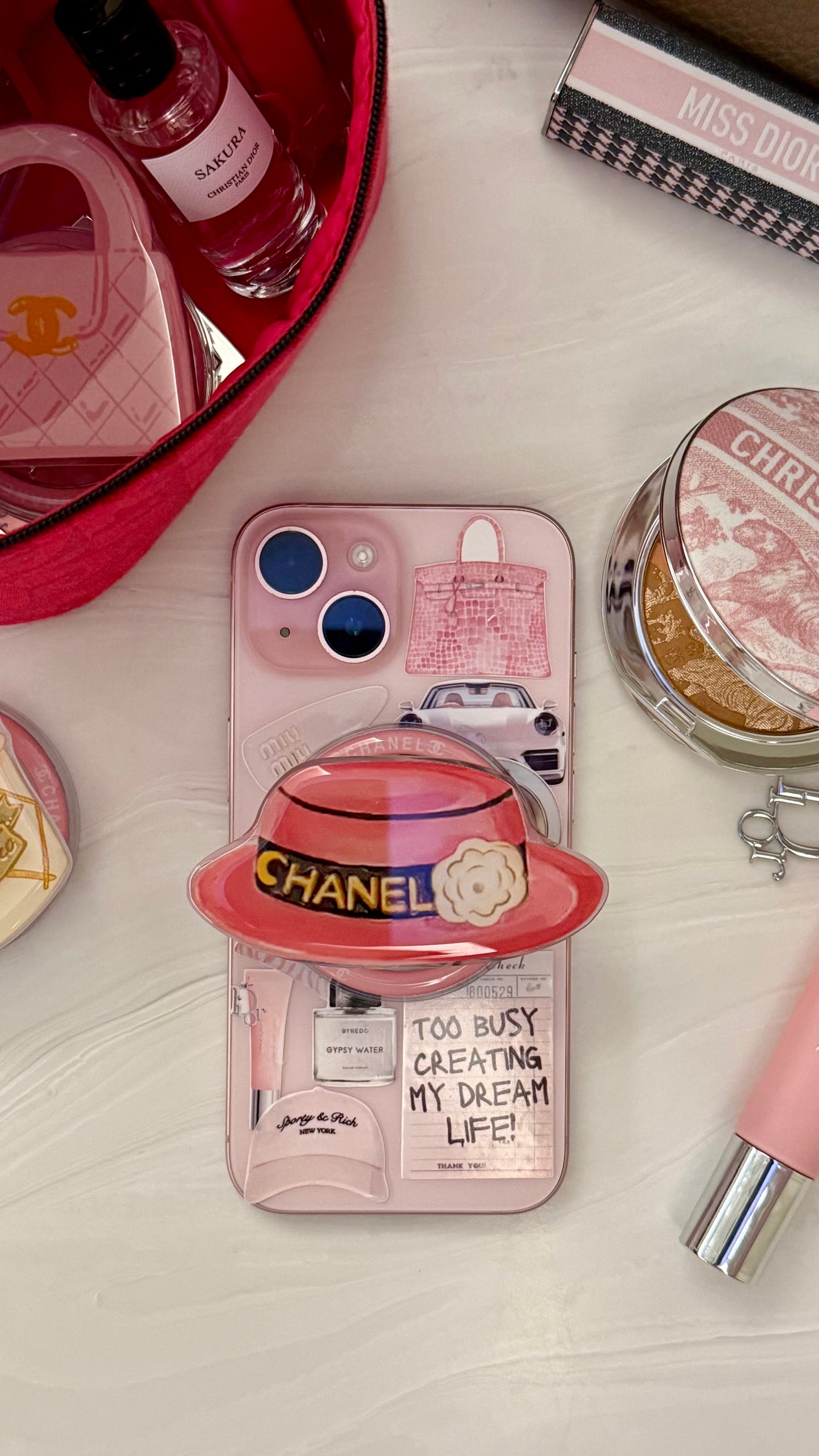 Chanel pink hat phone grip